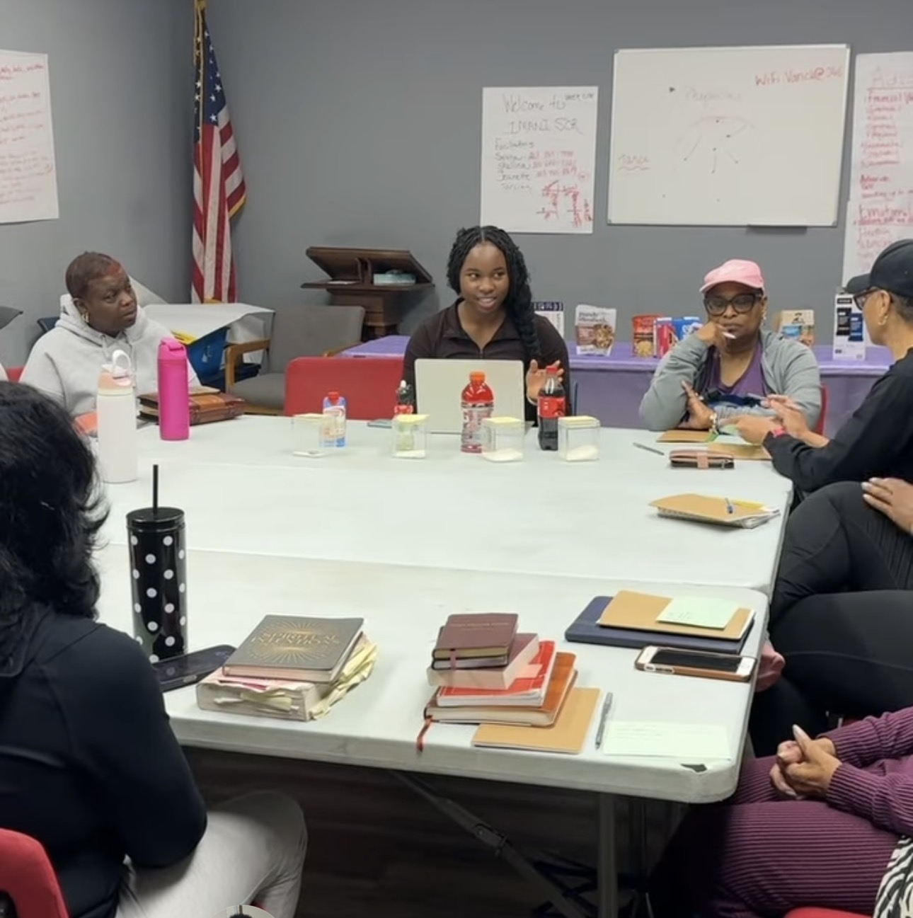 Congregation members gathered around tables for a Bible study and wellness session