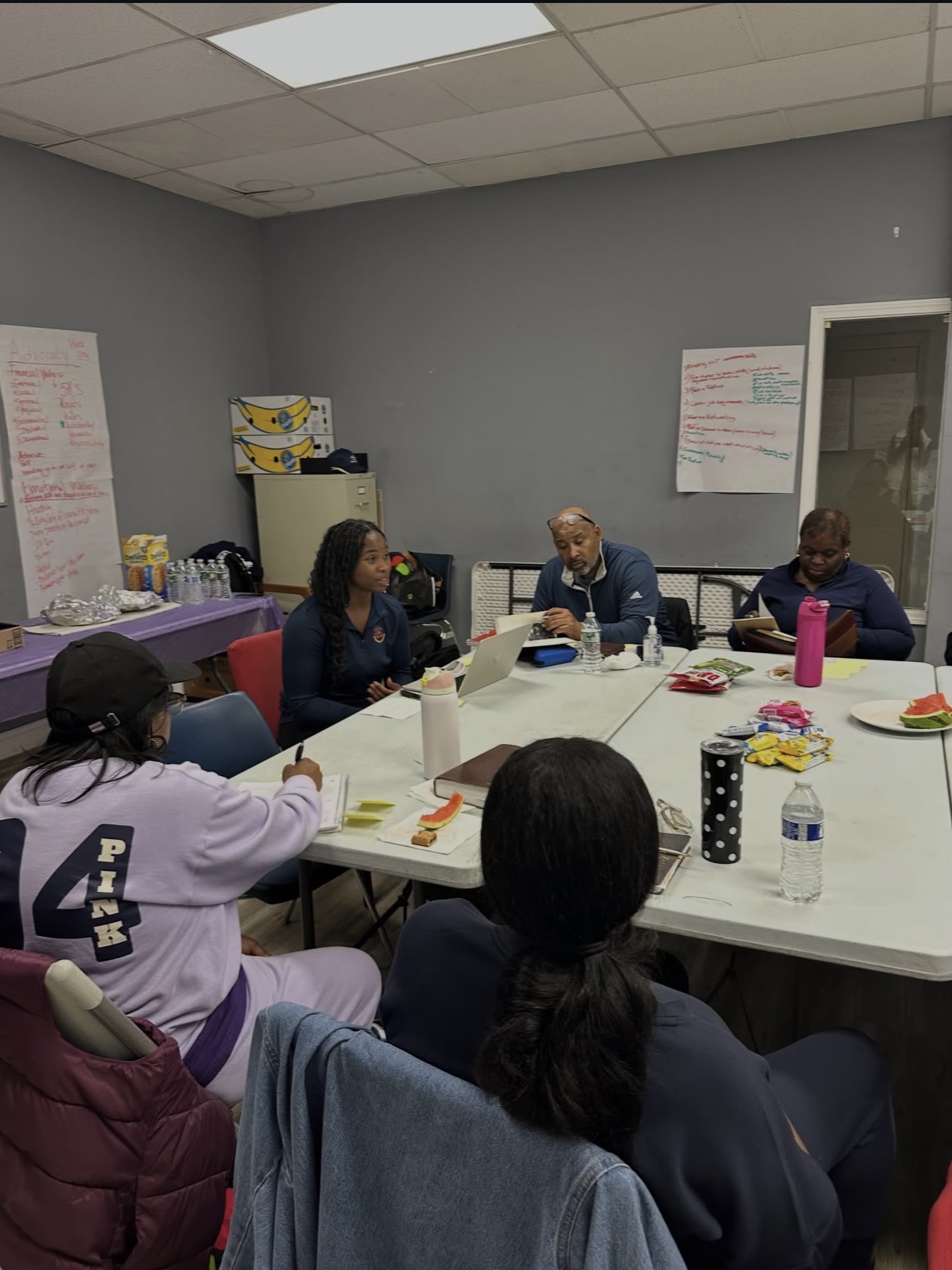 Leaders and members meeting together at a table