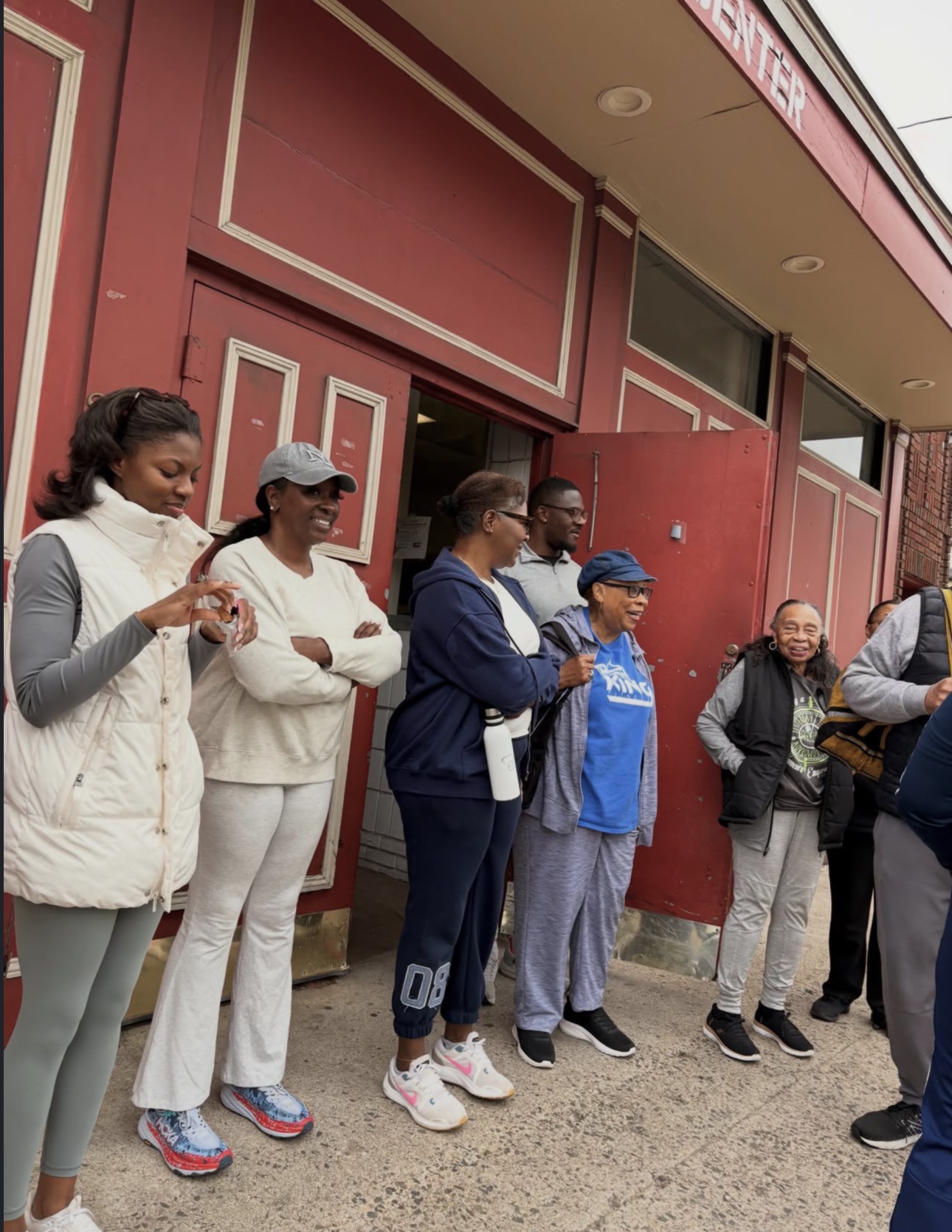 Fit in Faith members and leaders gathered and smiling outside the community center before a session