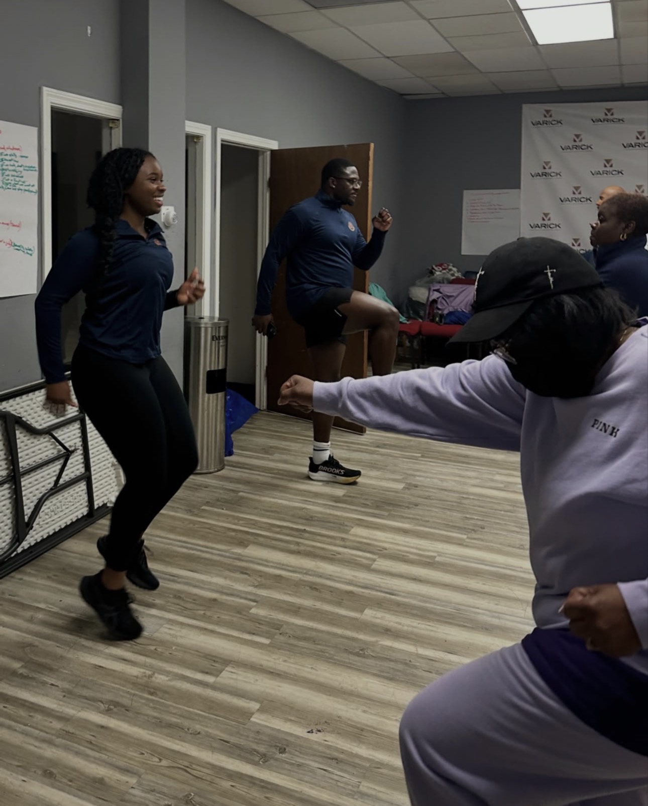 Members dancing together during a group session